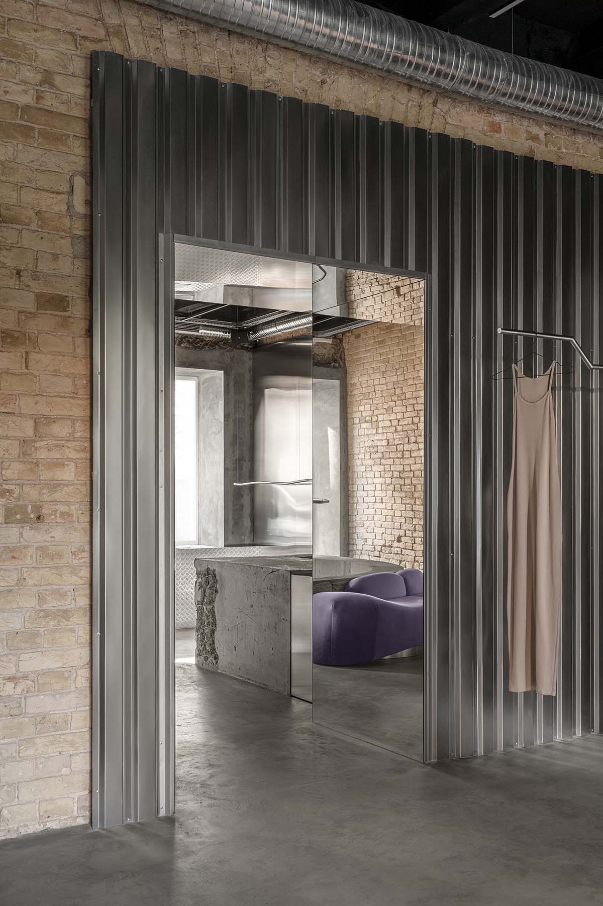 An early 20th-century building is transformed into a raw, industrial-looking interior for Kyiv store 