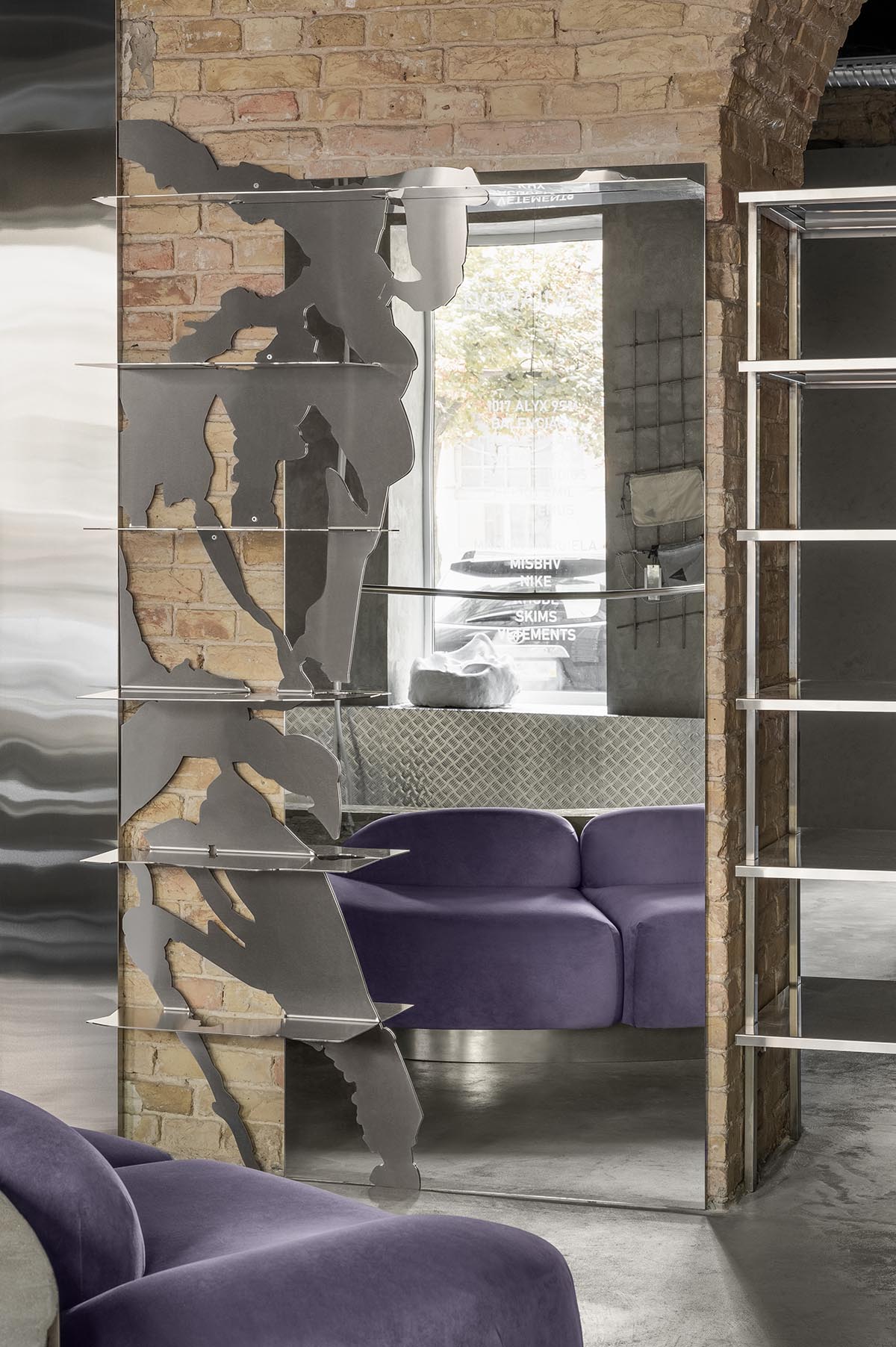 An early 20th-century building is transformed into a raw, industrial-looking interior for Kyiv store 