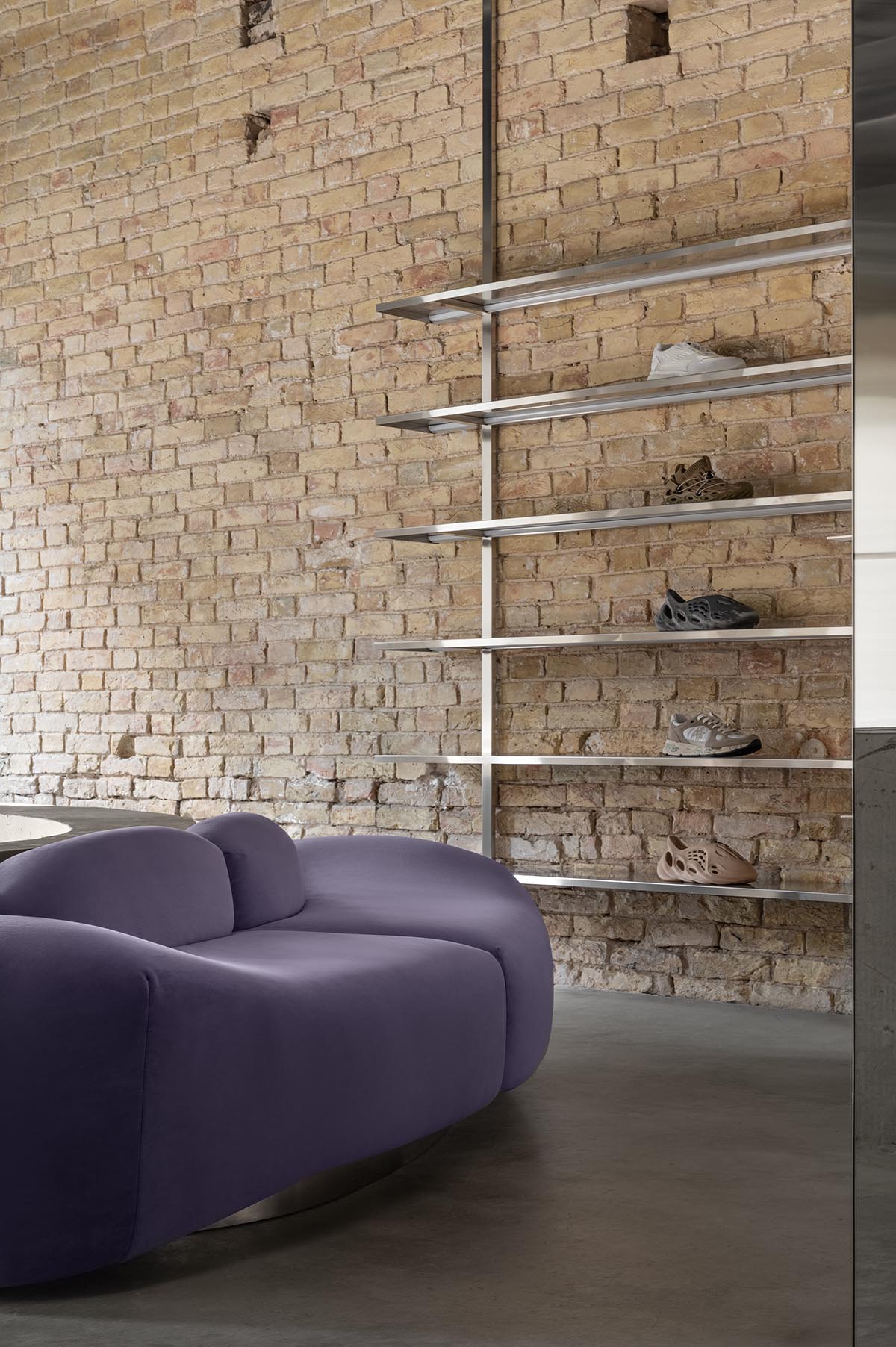 An early 20th-century building is transformed into a raw, industrial-looking interior for Kyiv store 