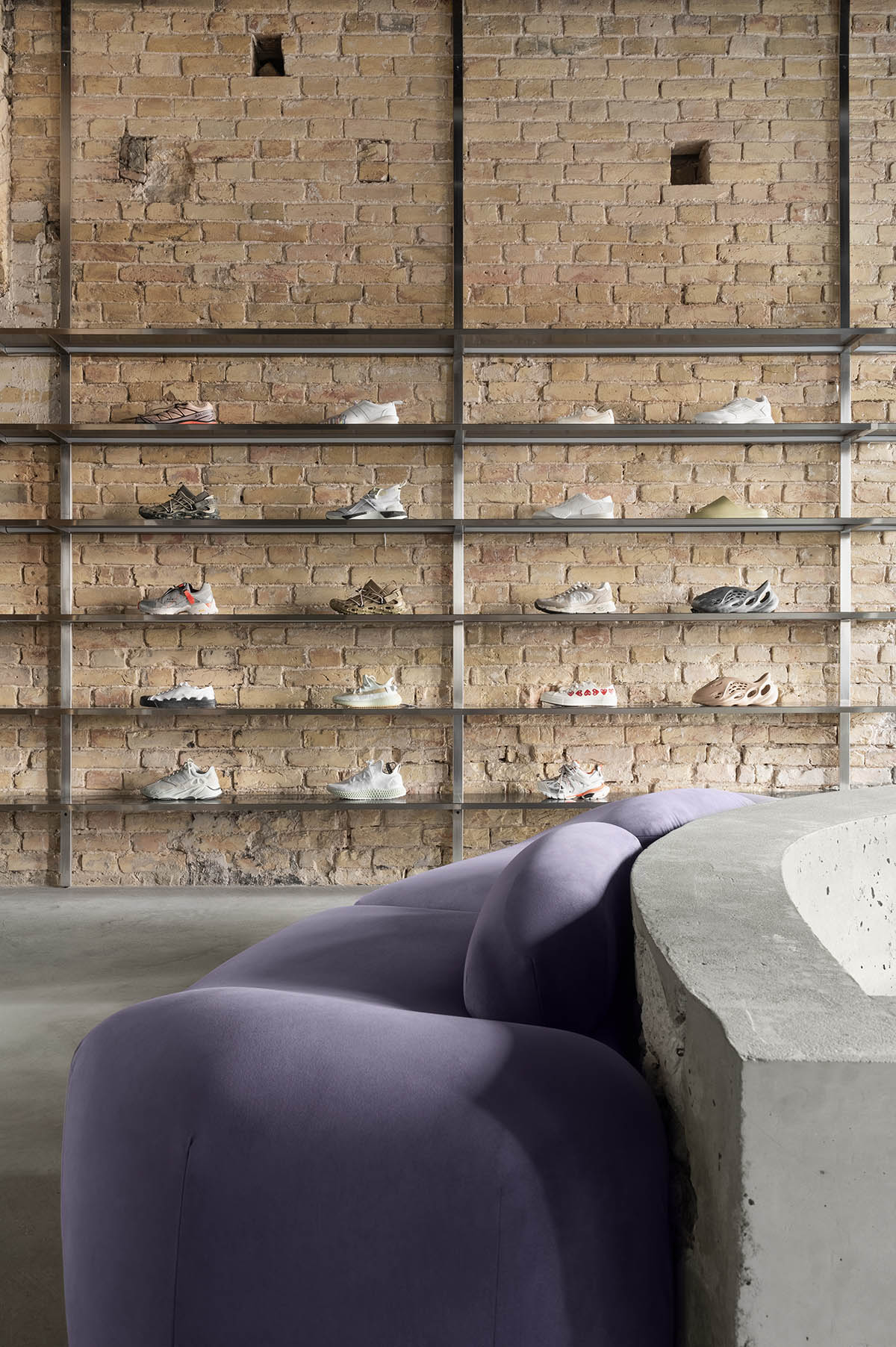 An early 20th-century building is transformed into a raw, industrial-looking interior for Kyiv store 