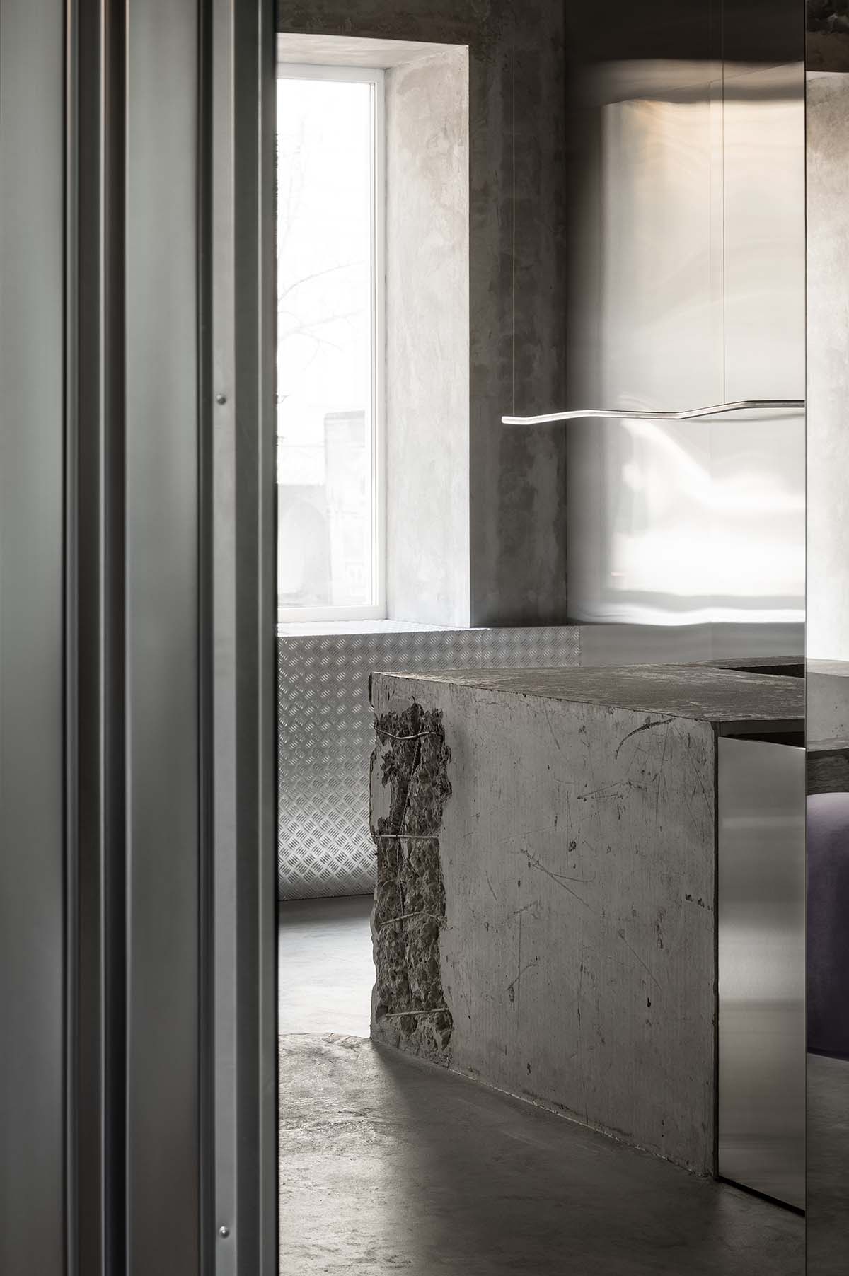 An early 20th-century building is transformed into a raw, industrial-looking interior for Kyiv store 