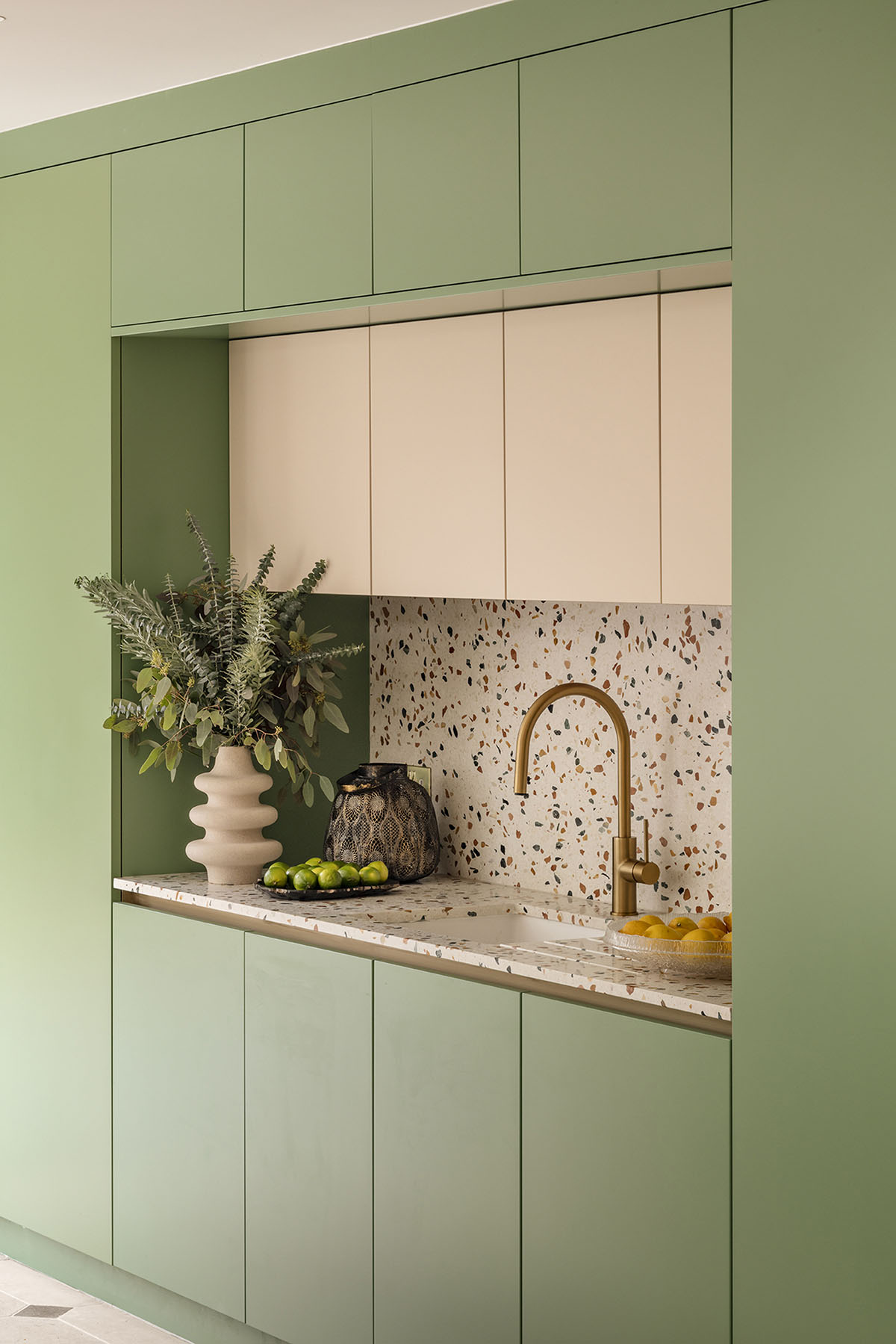 Studio Jayga Architects creates greenish and powder-colored interiors featuring arched doors in Essex