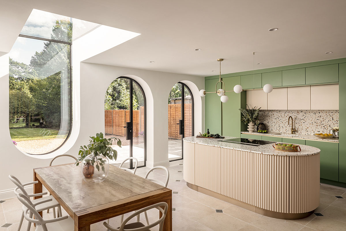 Studio Jayga Architects creates greenish and powder-colored interiors featuring arched doors in Essex
