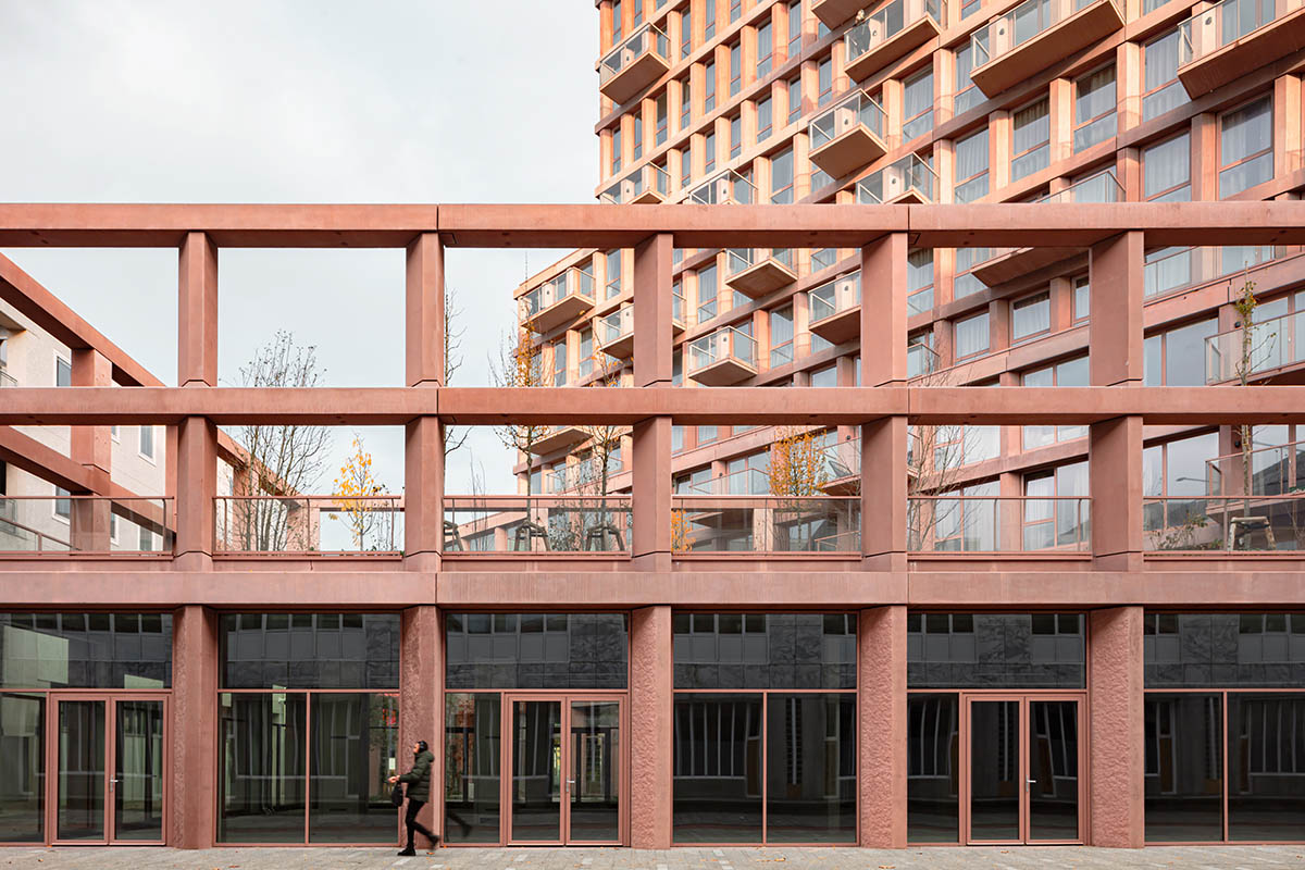 Studioninedots built soft red concrete residential tower in Almere