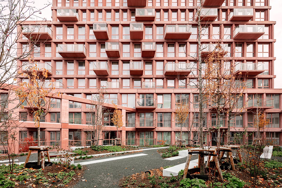 Studioninedots built soft red concrete residential tower in Almere