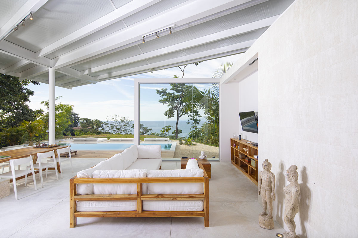 Large wing-like roof points out Santiago Hills Villa designed by Studio Saxe in Costa Rican jungle