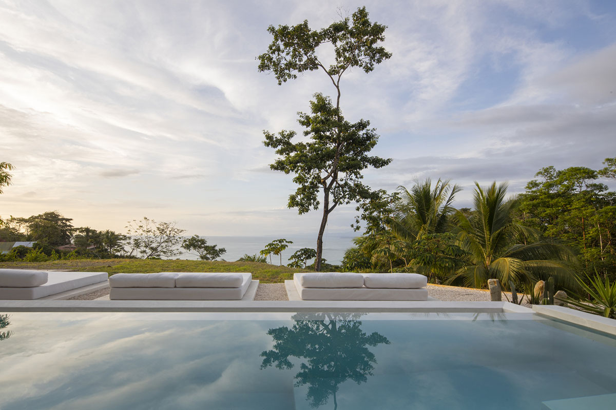 Large wing-like roof points out Santiago Hills Villa designed by Studio Saxe in Costa Rican jungle