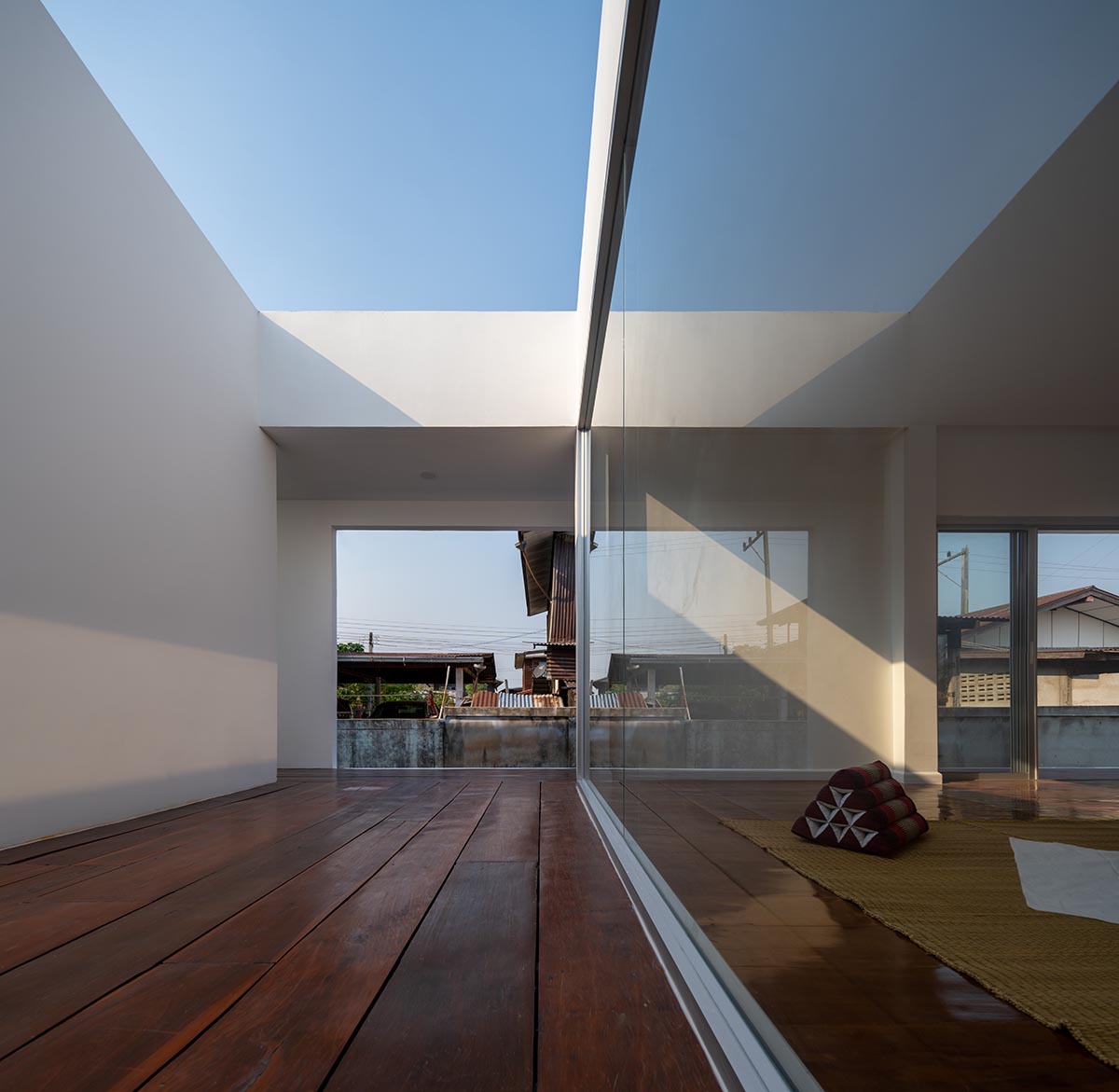 Tantai Architects imagines this house as a white box dancing with light and wind in Thailand 