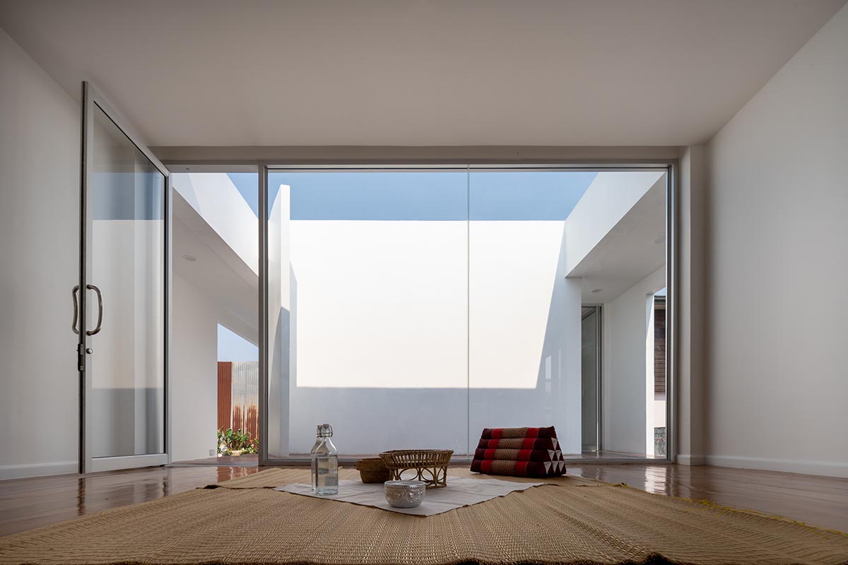 Tantai Architects imagines this house as a white box dancing with light and wind in Thailand 