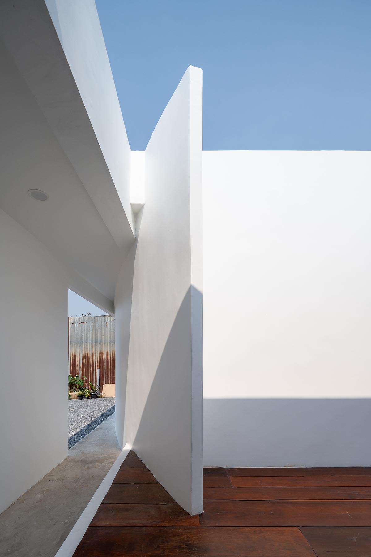 Tantai Architects imagines this house as a white box dancing with light and wind in Thailand 