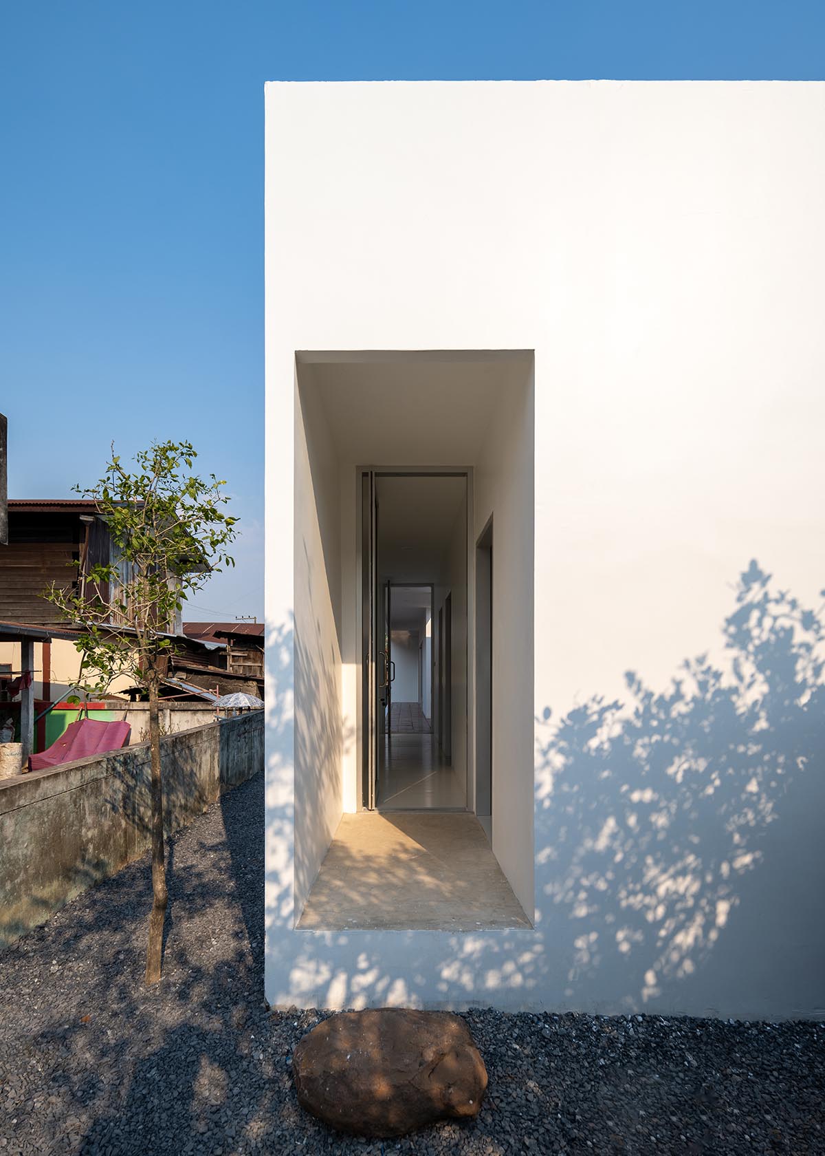 Tantai Architects imagines this house as a white box dancing with light and wind in Thailand 