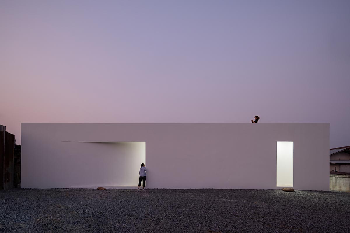Tantai Architects imagines this house as a white box dancing with light and wind in Thailand 