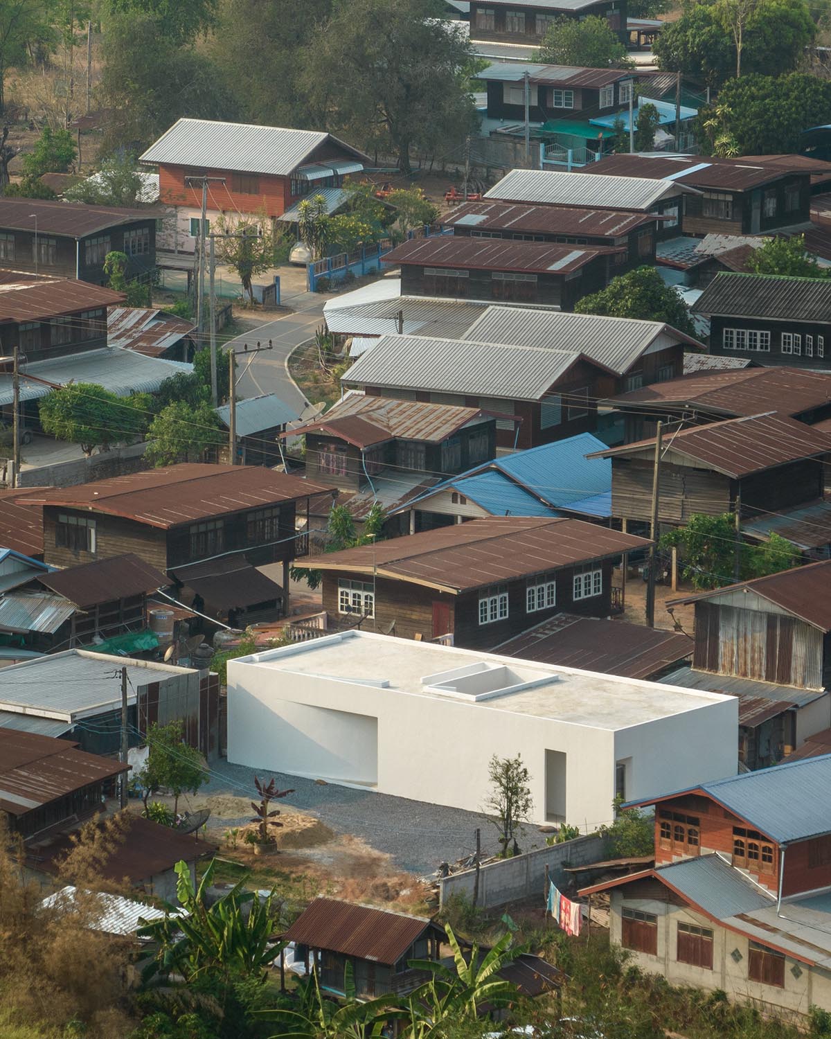Tantai Architects imagines this house as a white box dancing with light and wind in Thailand 