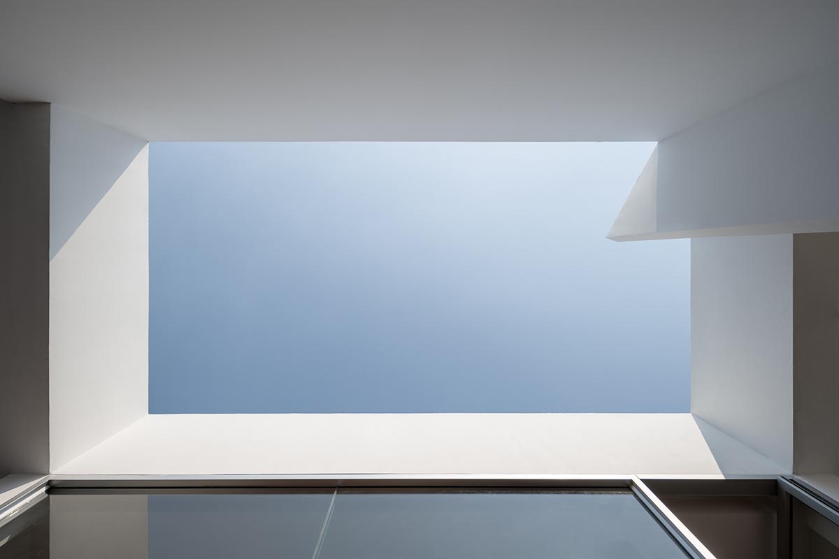 Tantai Architects imagines this house as a white box dancing with light and wind in Thailand 