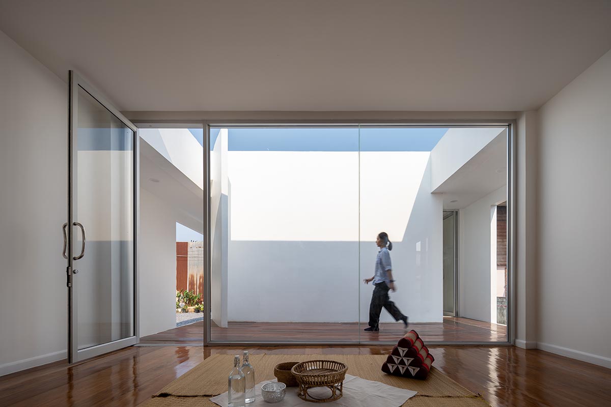 Tantai Architects imagines this house as a white box dancing with light and wind in Thailand 