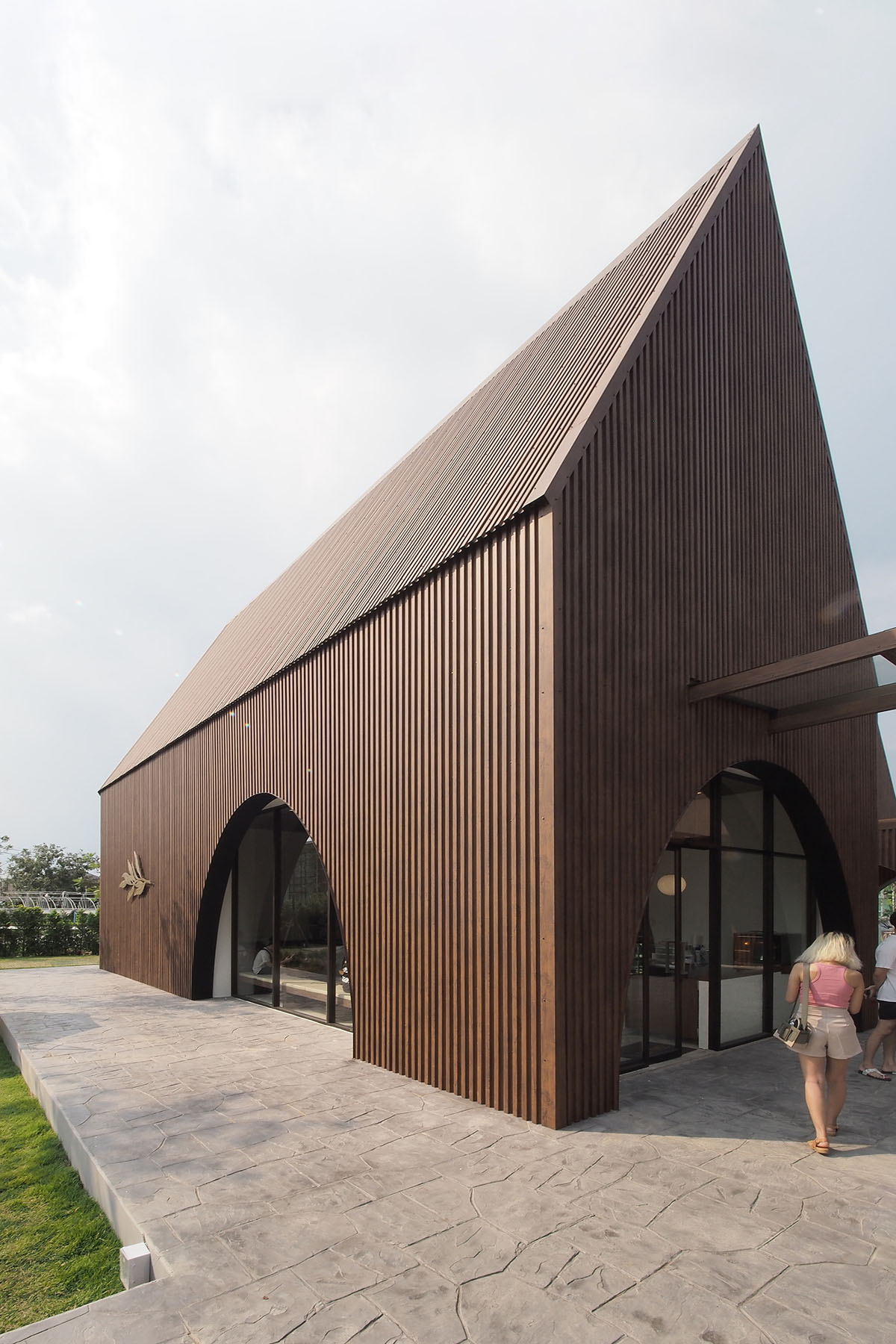 spacy architecture wraps serene bangkok cafe in floating glass