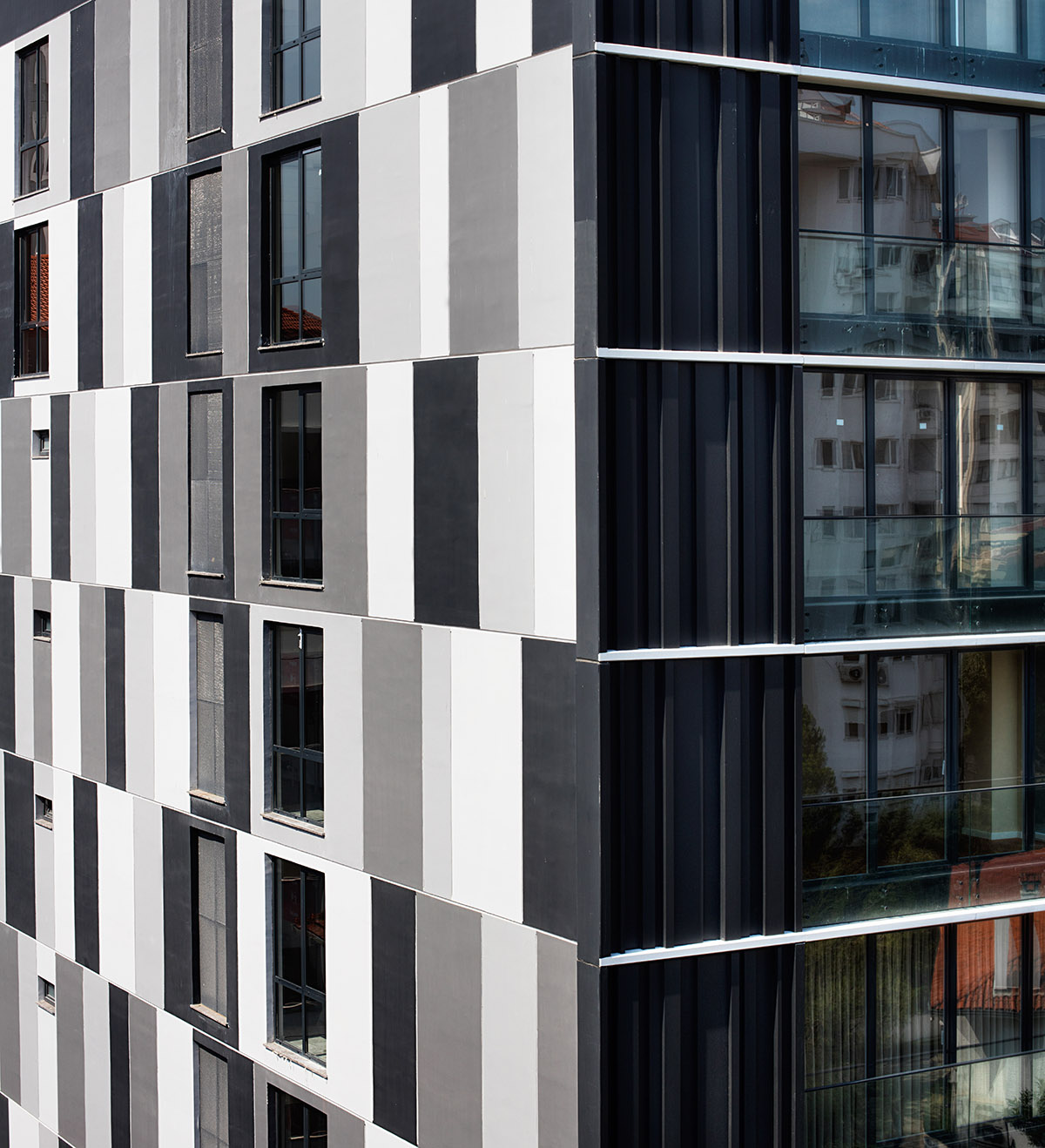 TAGO Architects creates urban industrial effect in Boutique Maya Residence