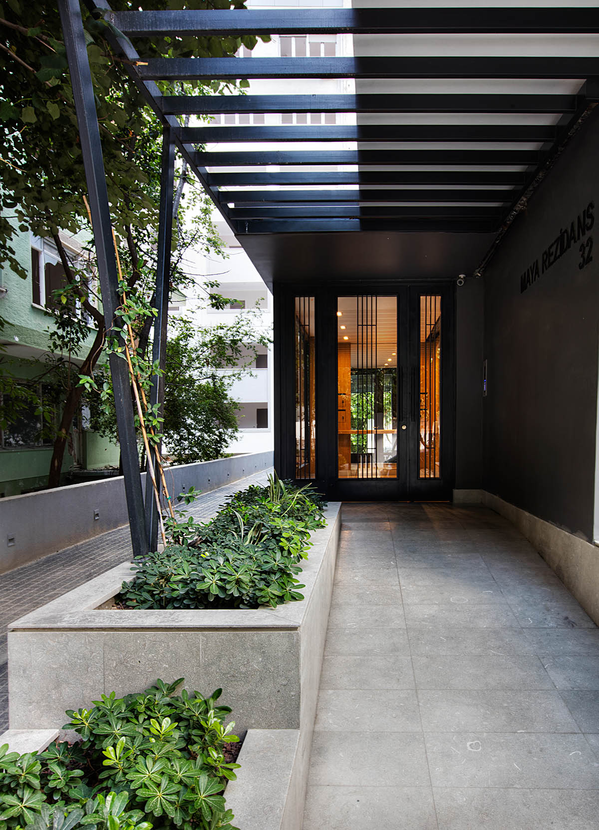 TAGO Architects creates urban industrial effect in Boutique Maya Residence