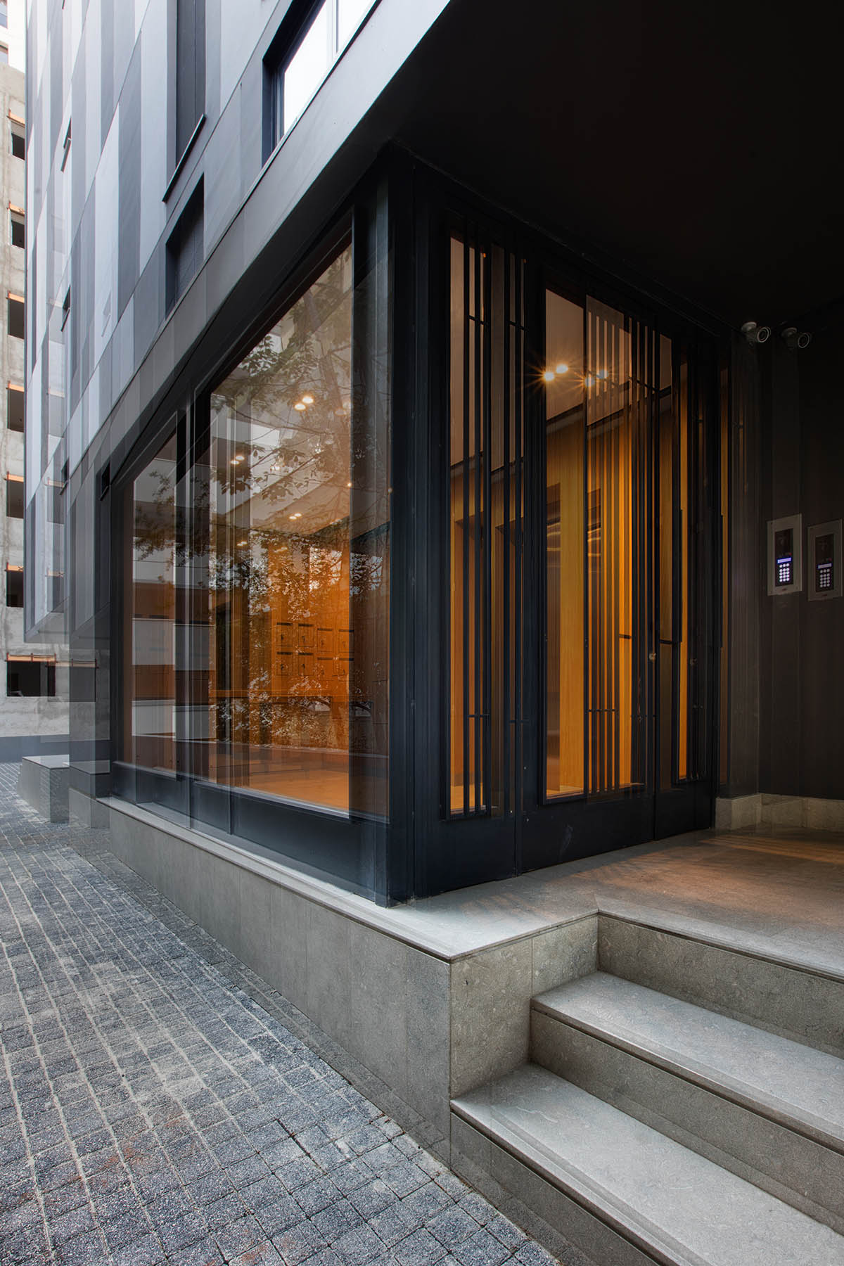 TAGO Architects creates urban industrial effect in Boutique Maya Residence