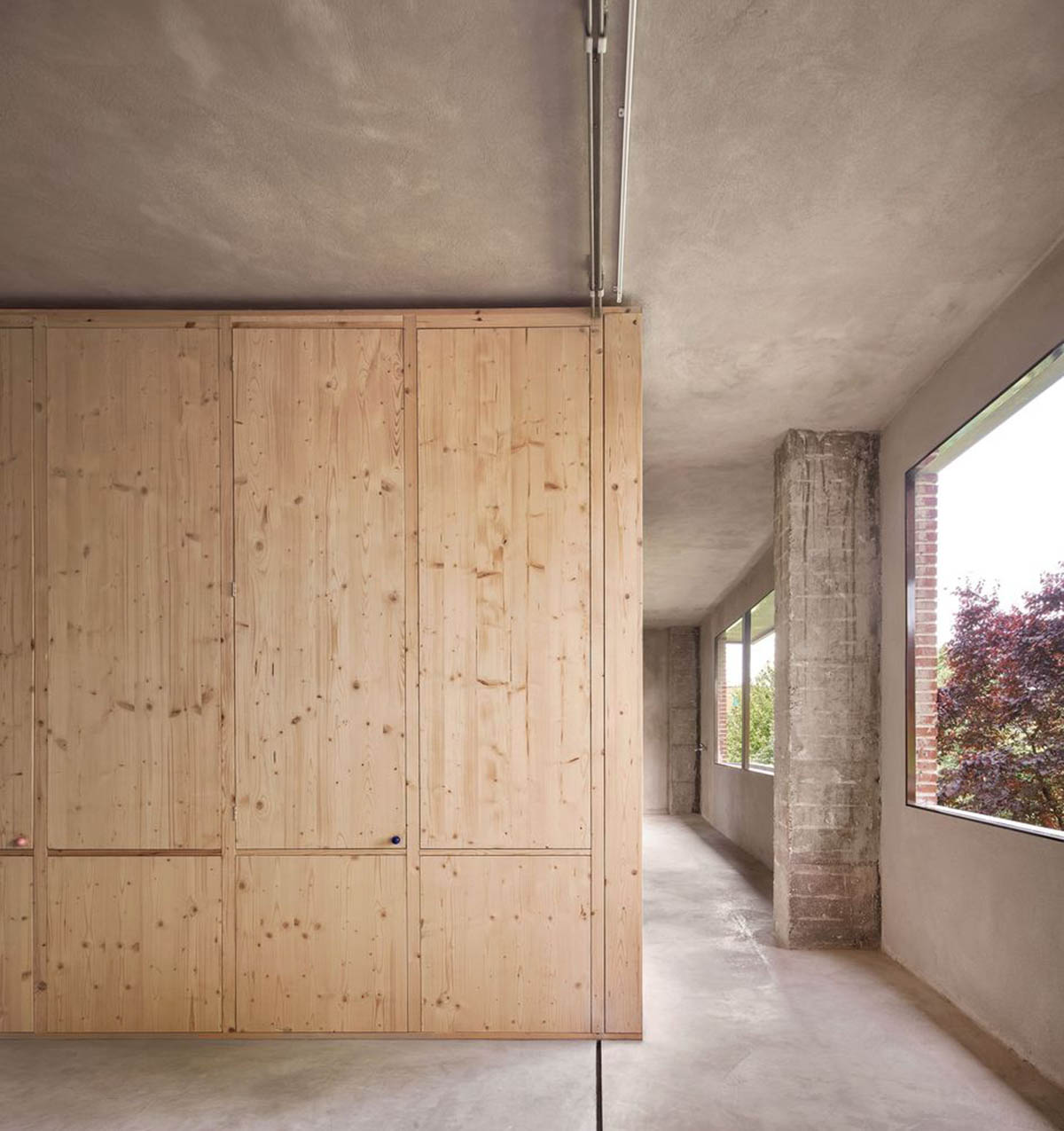 Takk renovates interior of a house in Madrid with wood and natural cork for energy efficiency