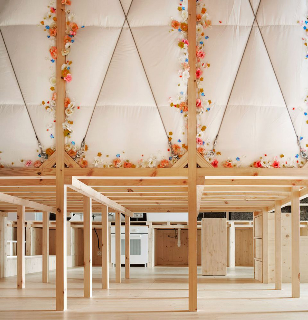 Takk renovates interior of a house in Madrid with wood and natural cork for energy efficiency