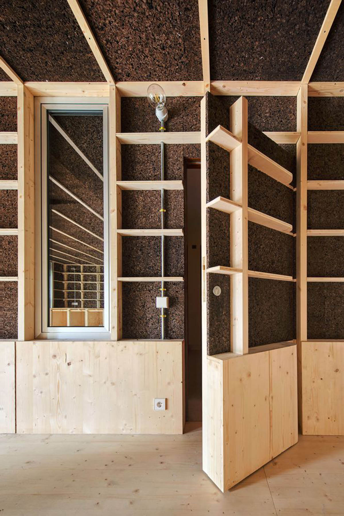 Takk renovates interior of a house in Madrid with wood and natural cork for energy efficiency