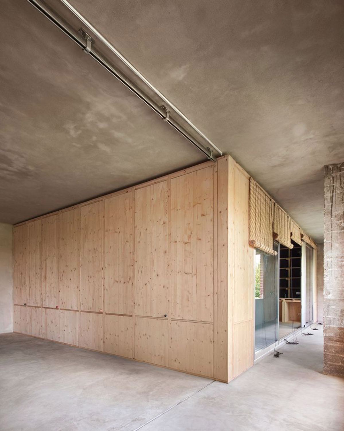 Takk renovates interior of a house in Madrid with wood and natural cork for energy efficiency