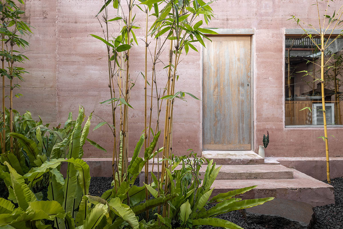 Blancostudio wraps pottery shop with rammed-earth walls with zen garden in Ubud 