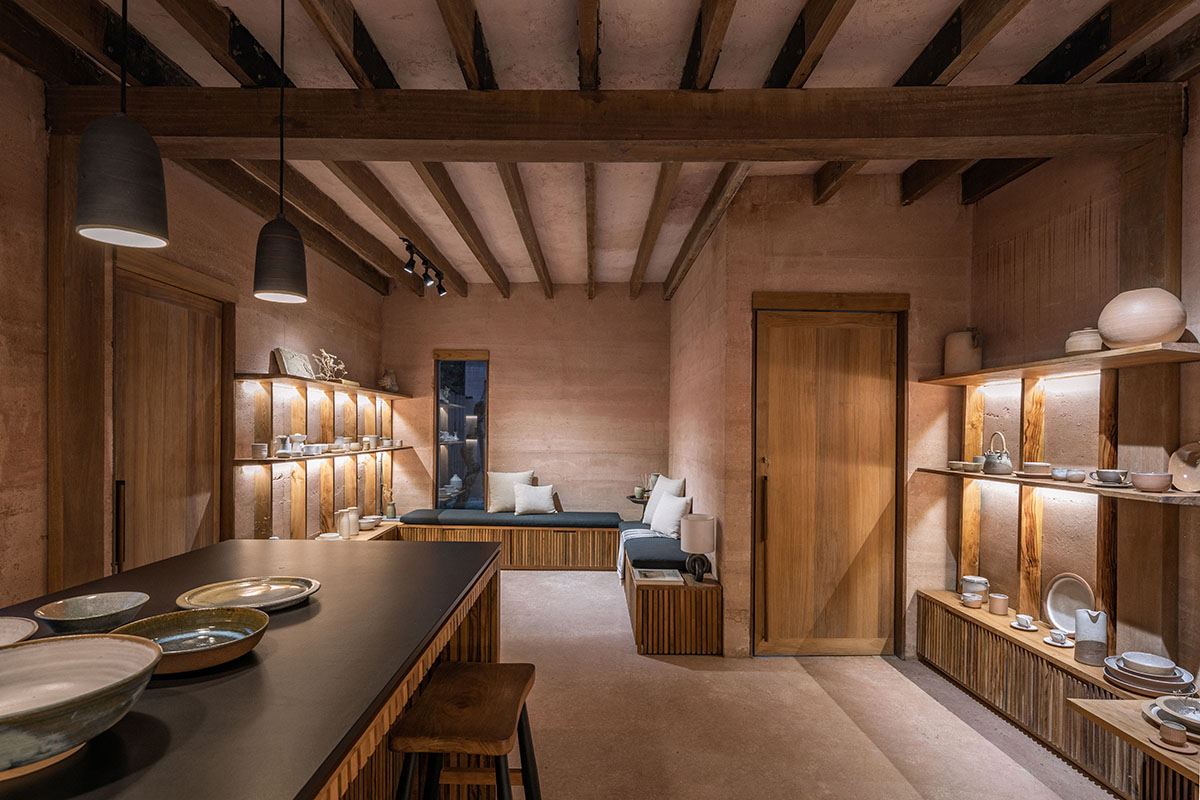 Blancostudio wraps pottery shop with rammed-earth walls with zen garden in Ubud 