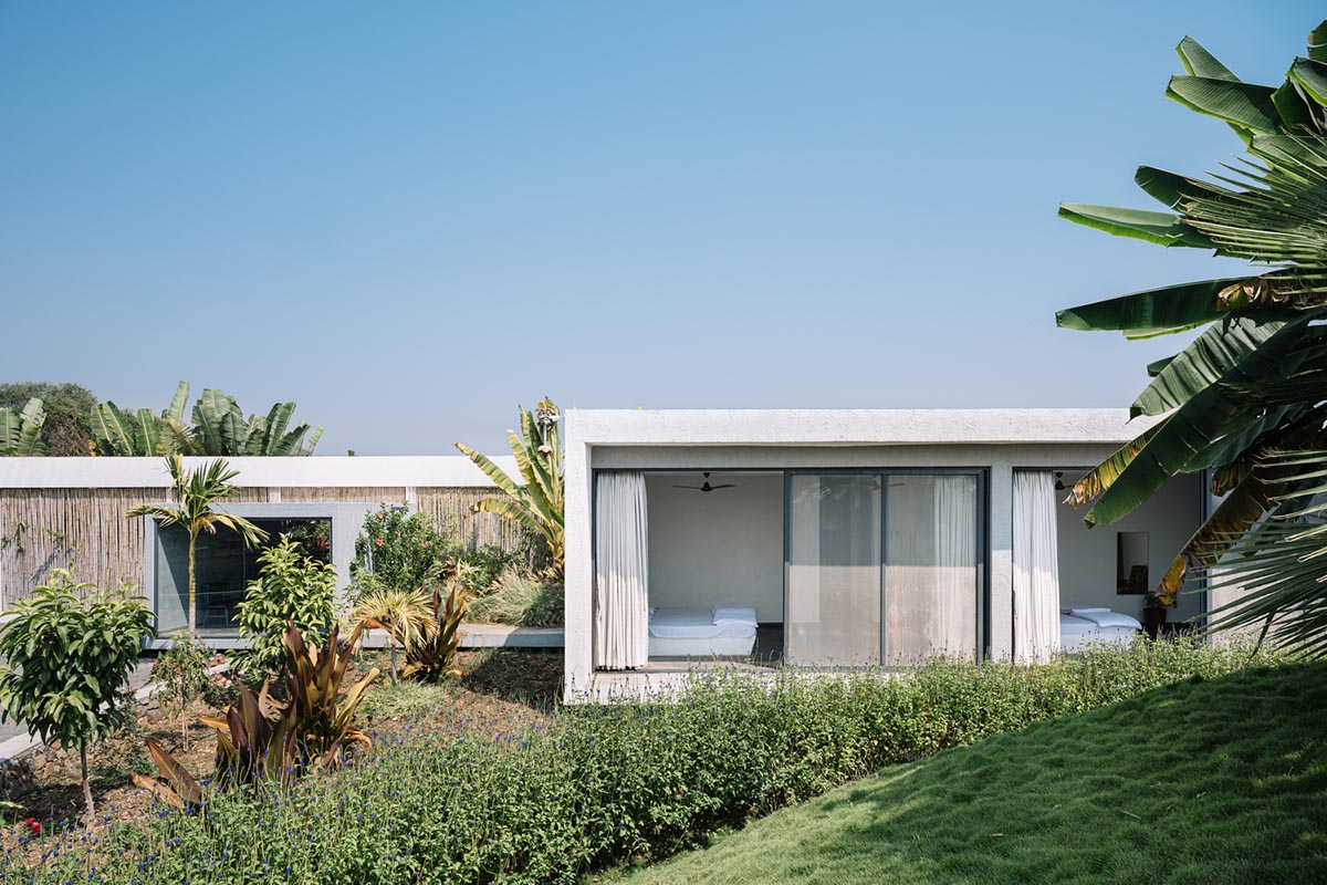 Weekend home is clad in bamboo screens that create a rustic appearance on the outskirts of Pune