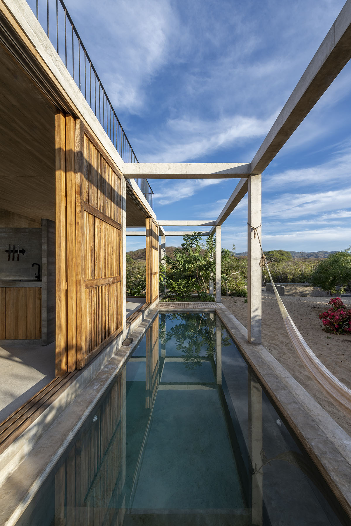 Concrete columns and beams wrap Cosmos House designed by S-AR in Mexico