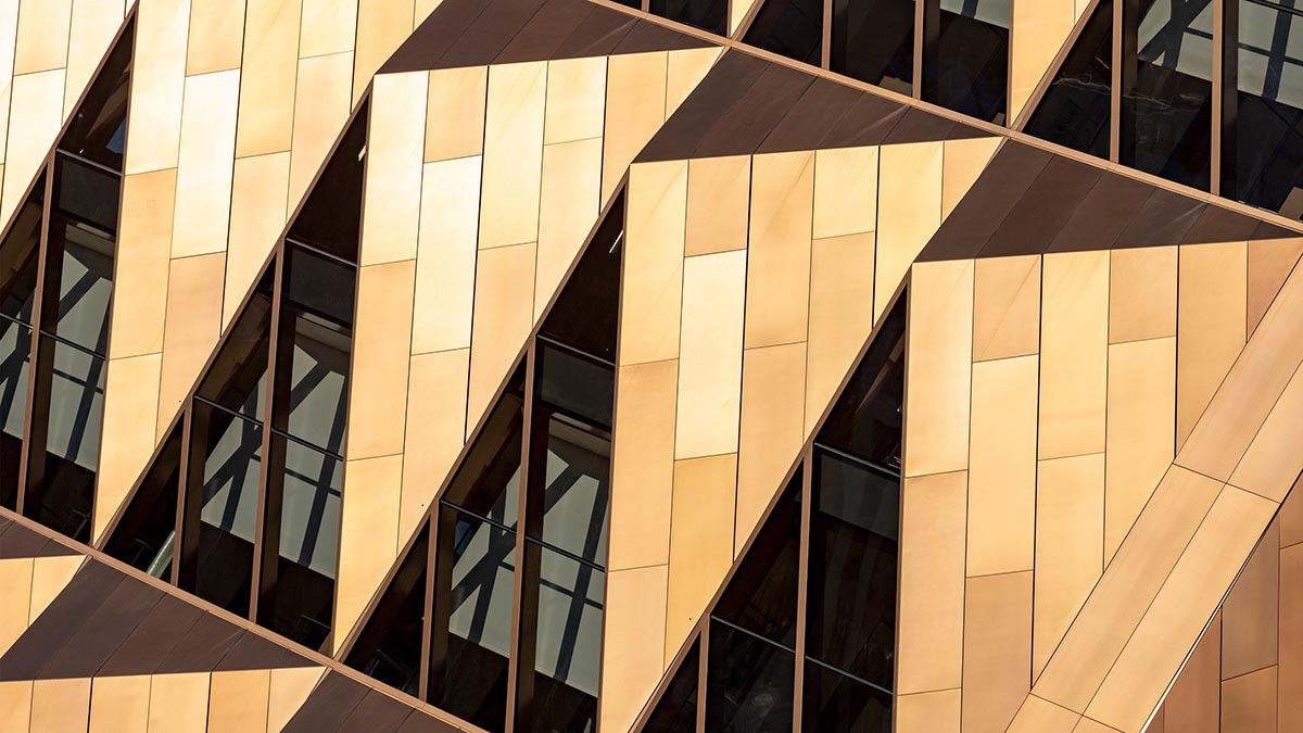 Foster + Partners completes office tower clad by triangular pieces of copper in Yekaterinburg