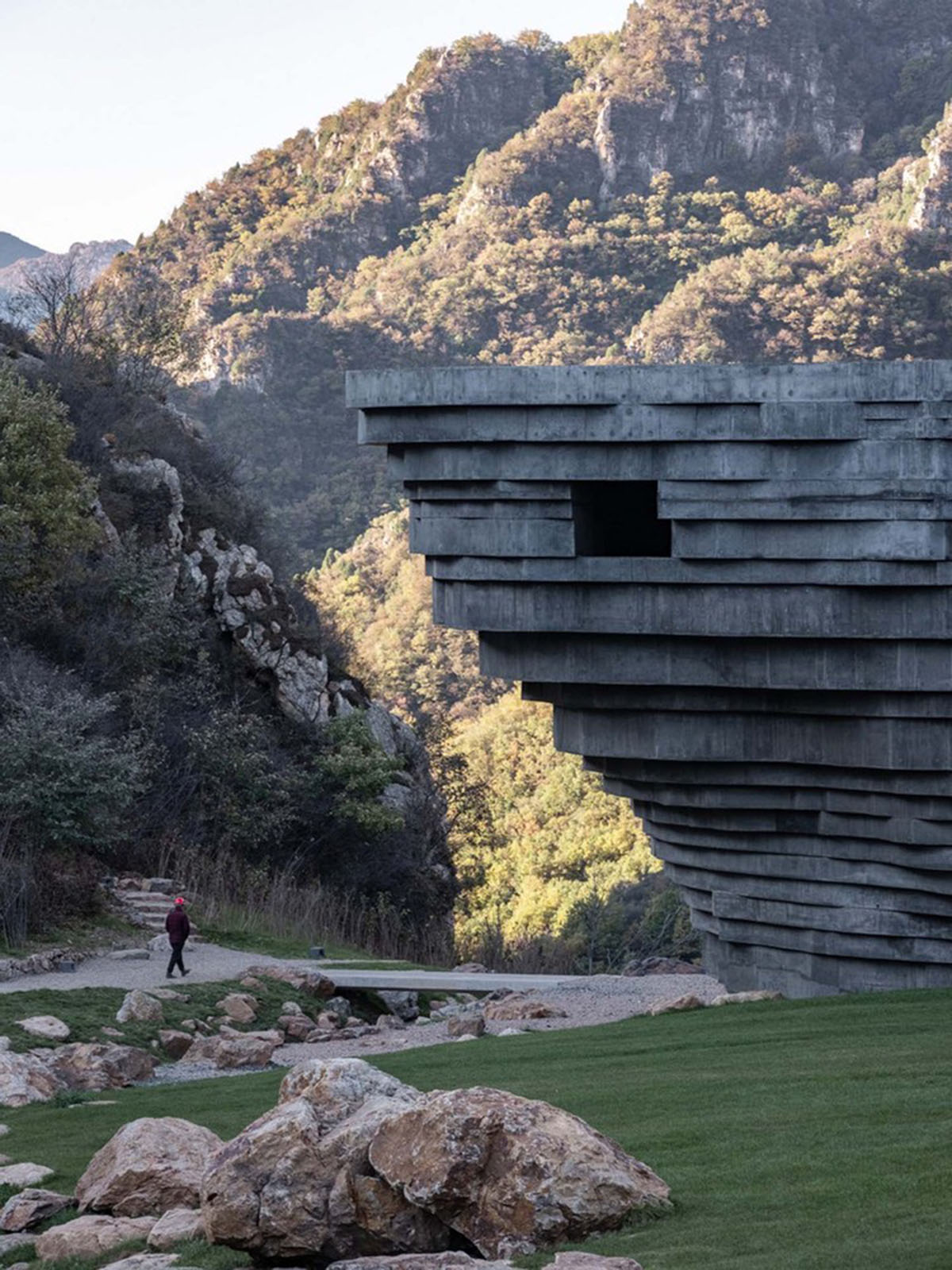 OPEN Architecture designs monolithic rock-like open-air concert hall in the north of Beijing