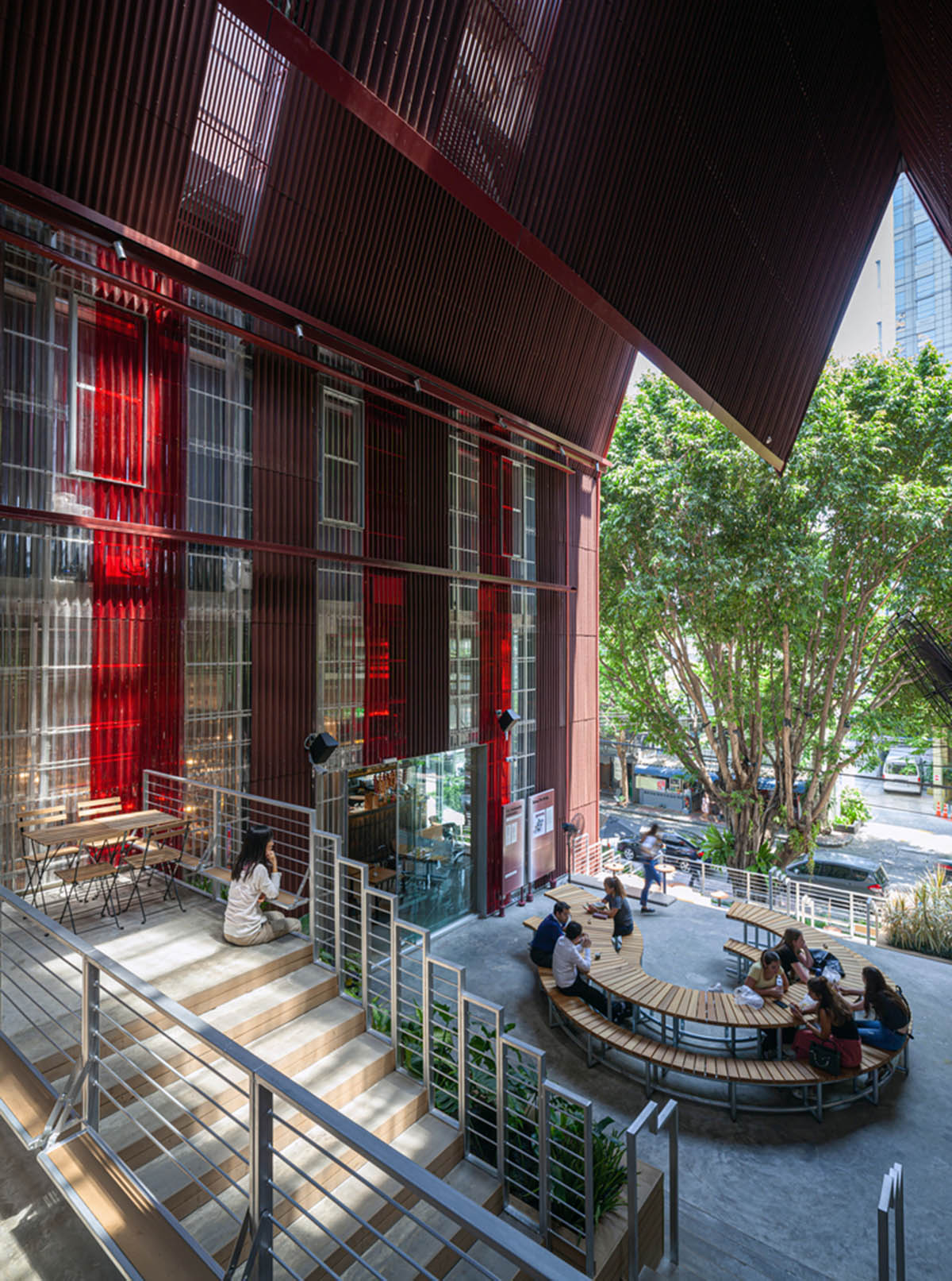 Department of ARCHITECTURE built pavilion with red transparent corrugated sheets for its roof