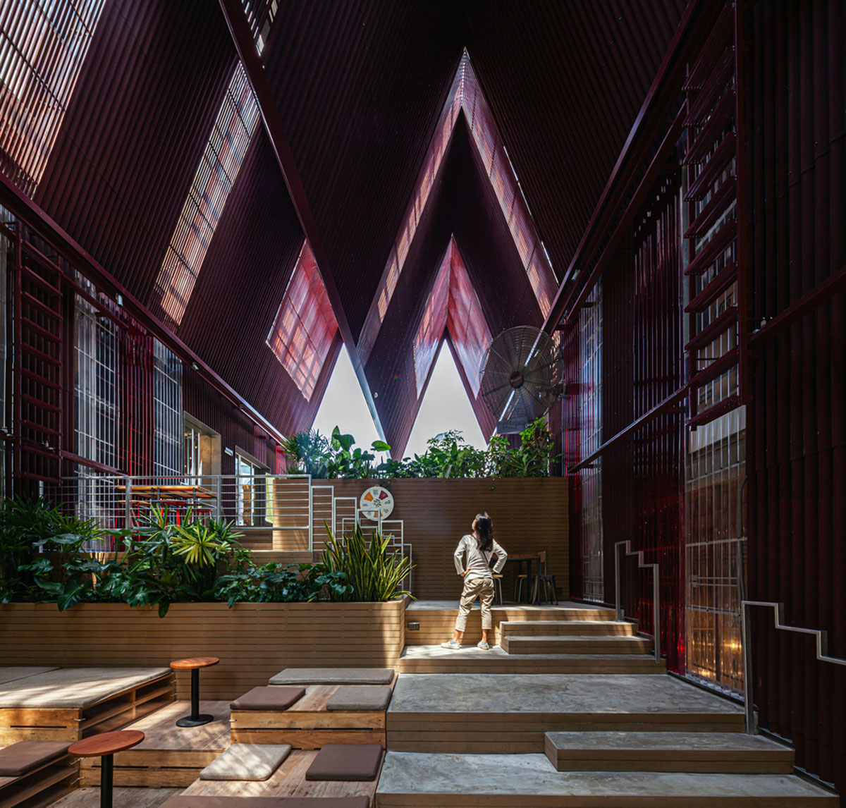 Department of ARCHITECTURE built pavilion with red transparent corrugated sheets for its roof