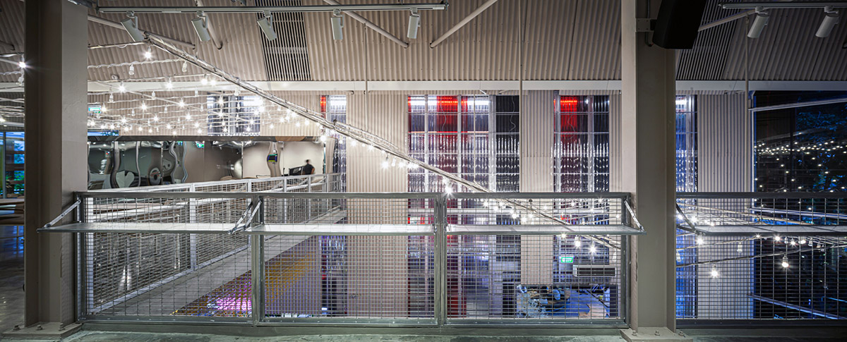 Department of ARCHITECTURE built pavilion with red transparent corrugated sheets for its roof