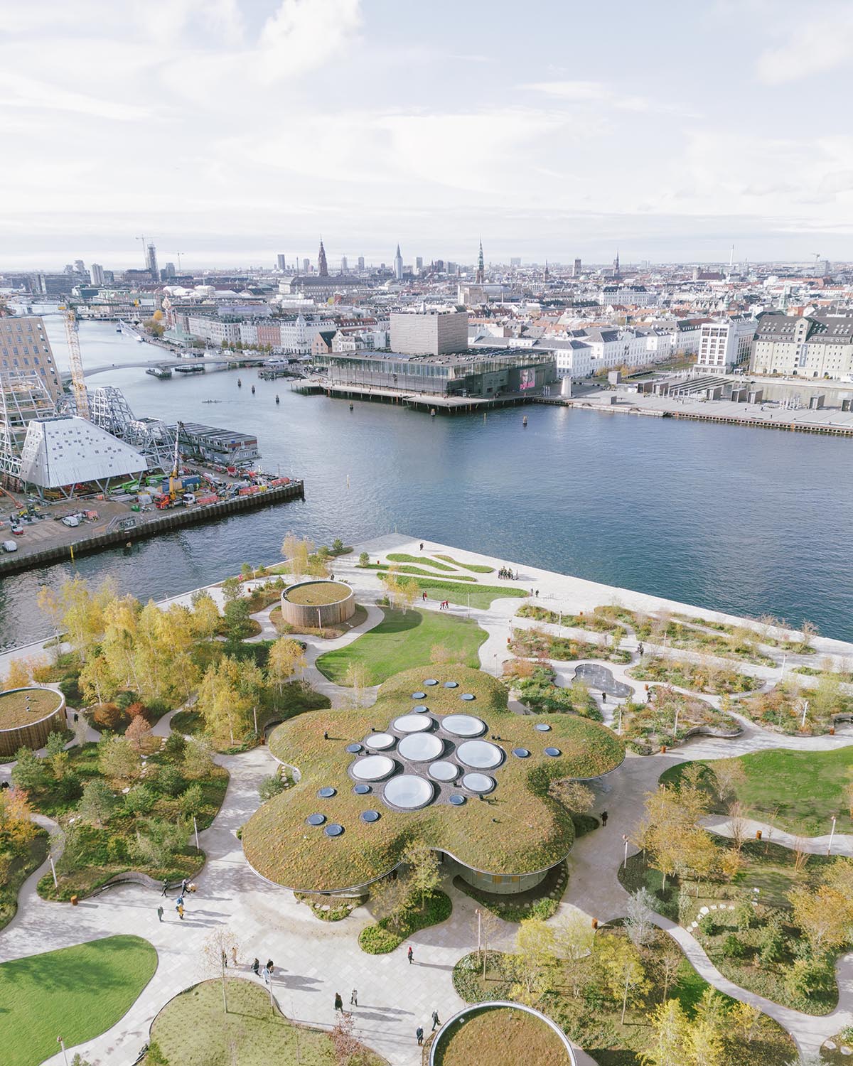 Cobe unveils The Opera Park with flower-shaped greenhouse and atrium in Copenhagen's inner harbor