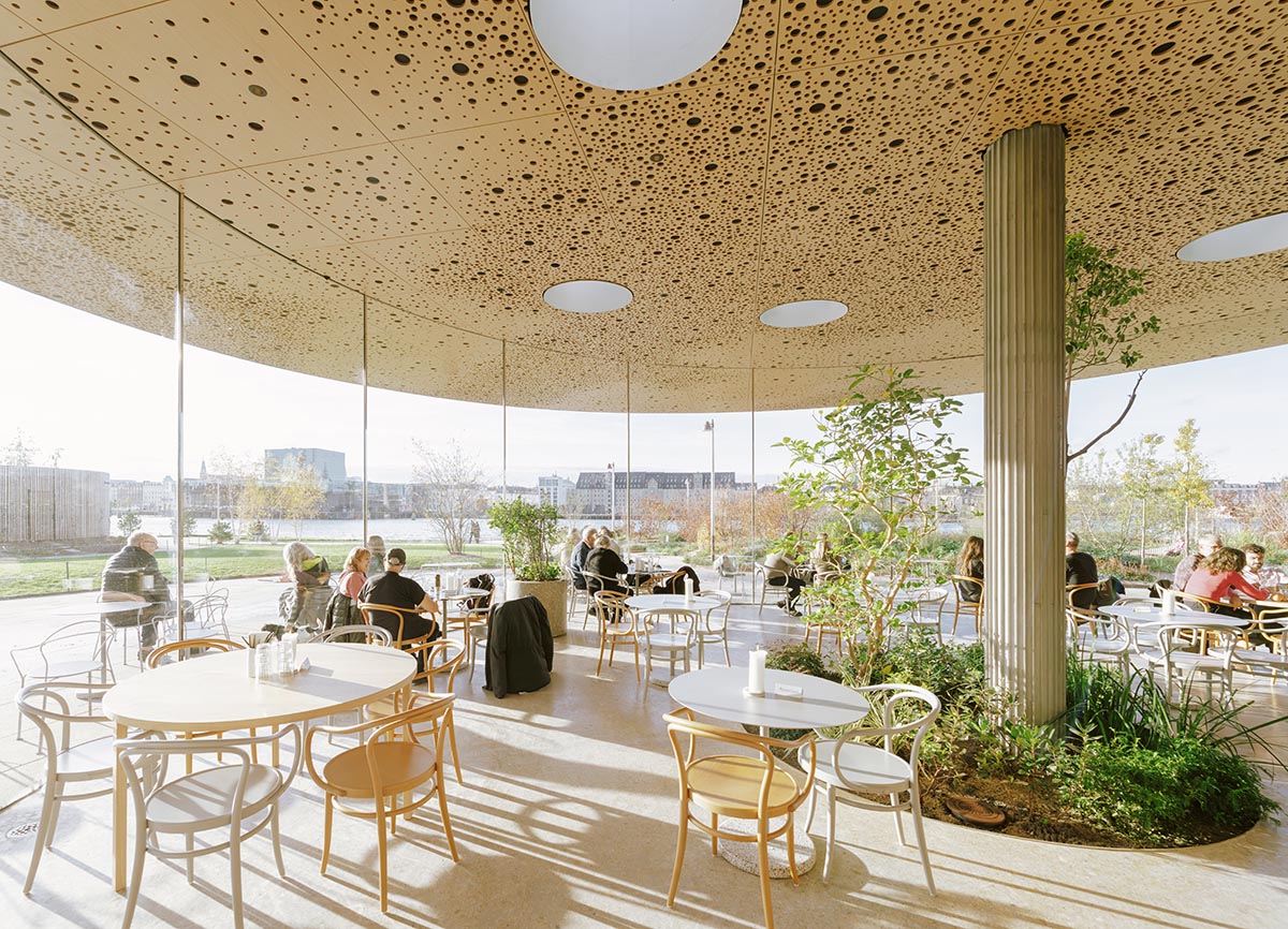 Cobe unveils The Opera Park with flower-shaped greenhouse and atrium in Copenhagen's inner harbor