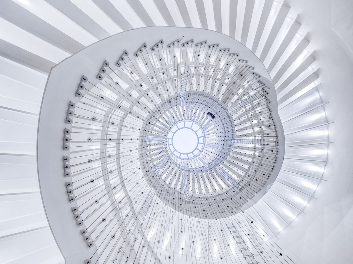 Ten towering cylindrical cement silos are converted to house immersive library of books in China