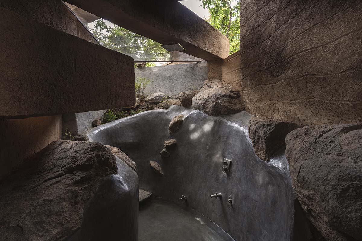 Wallmakers reveals snake house that forms a whirlpool on a steep hillside in India