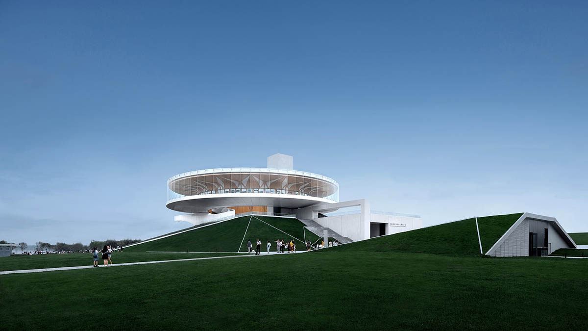 STUDIO A+ designs climbable ring-shaped art center on a green mound in Zhengzhou