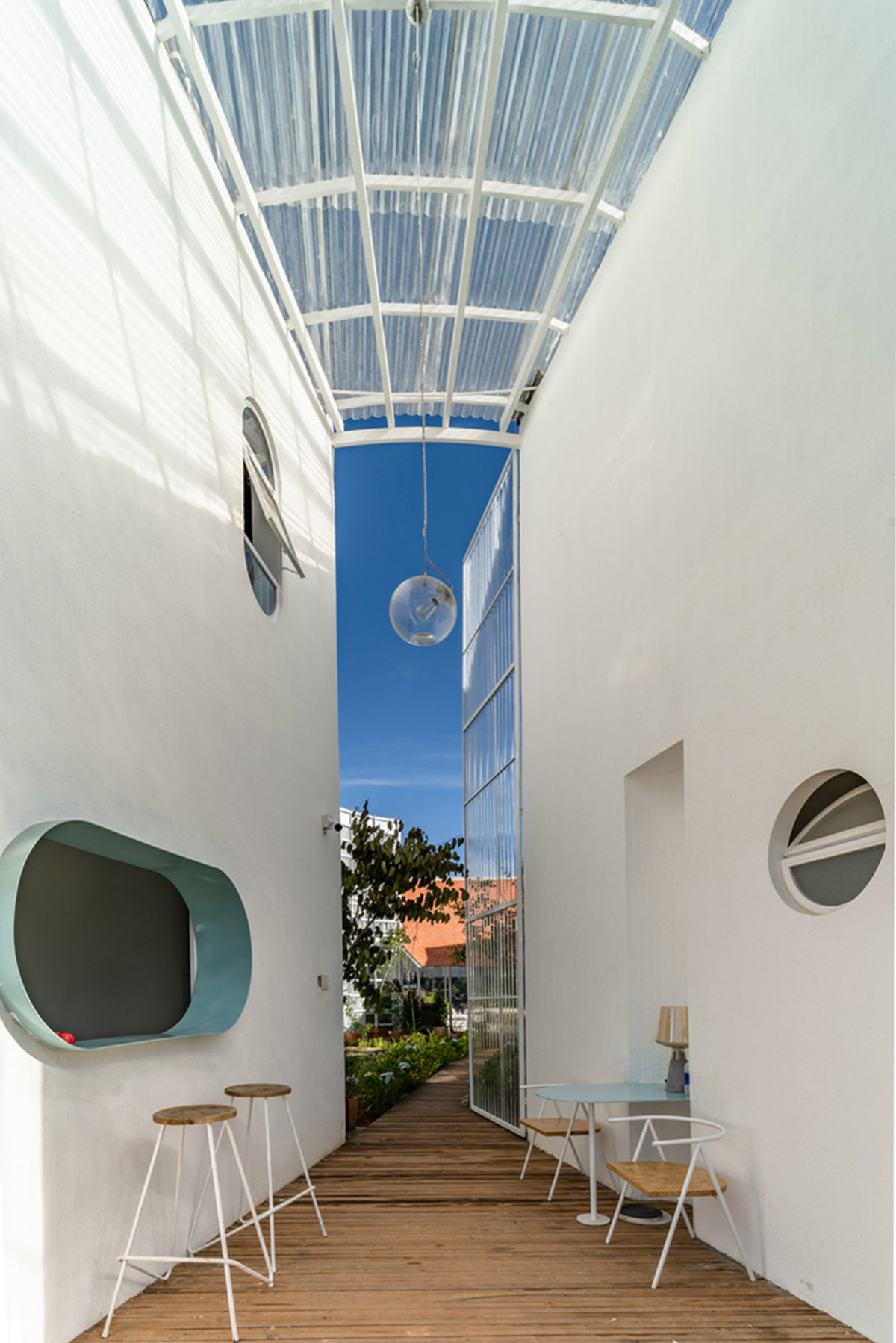 G+ Architects completes all-white circular L00P Boutique Hotel and Café in Vietnam