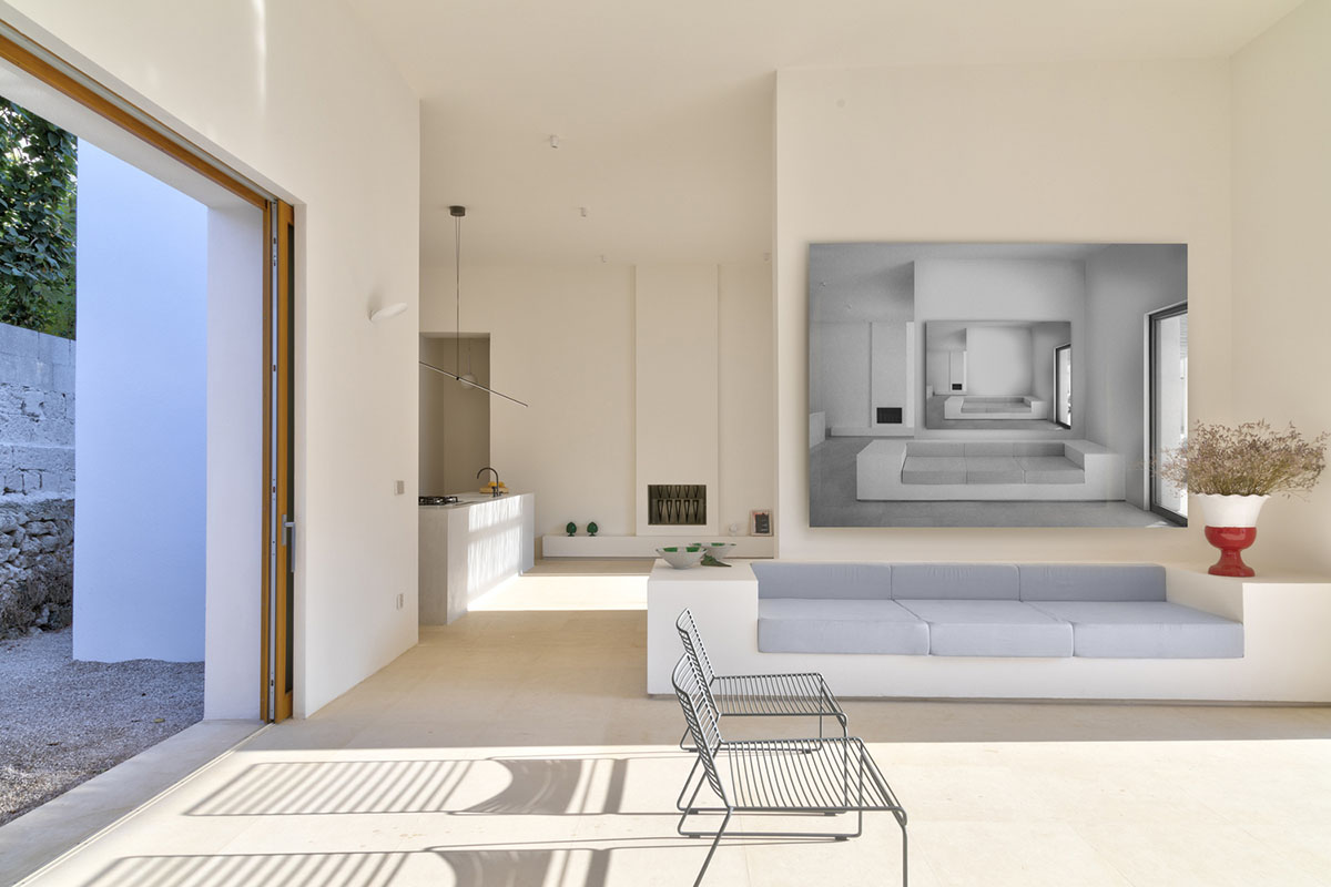 Dos Architects creates small patios with an interplay of all-white volumes for house in Salento