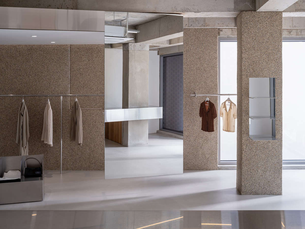 Warm colors are harmonized with floating linear elements in Towpath Shop by Studio GIMGEOSIL