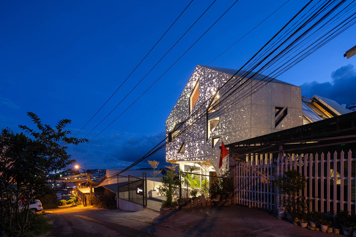 Le House wraps this small hotel with porous steel facade made of irregular patterns in Vietnam
