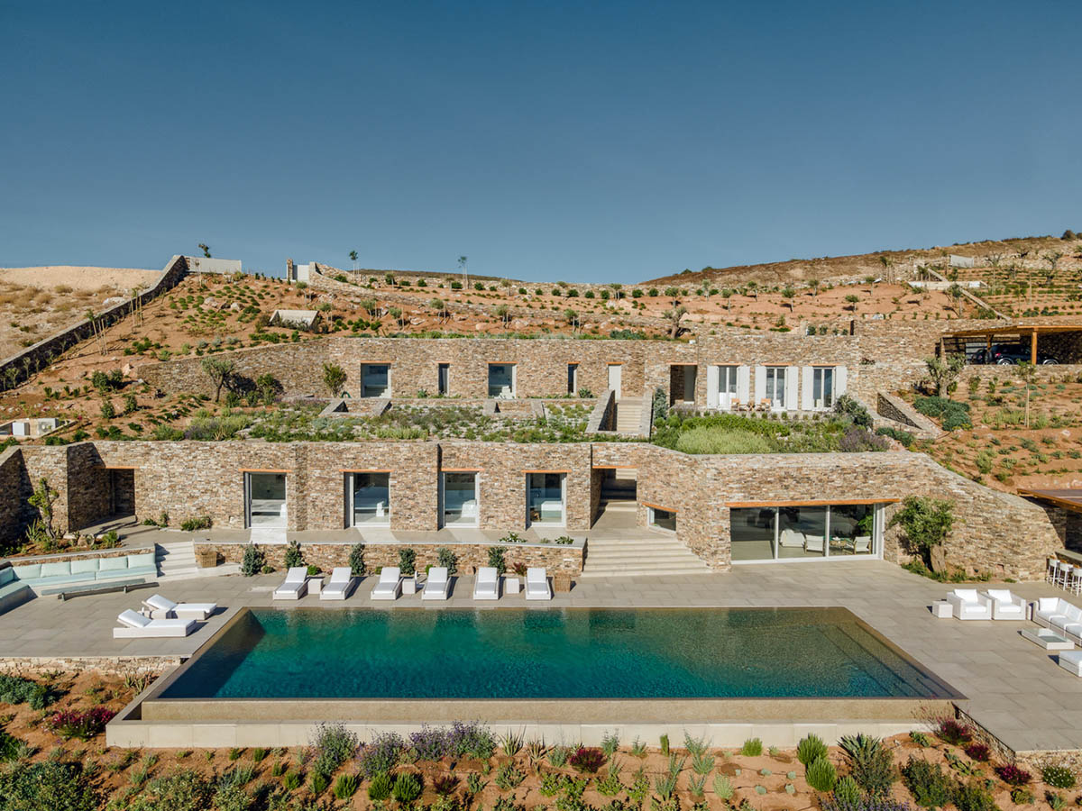 Encaved Stone Villa by Tsolakis Architects mimics natural terrain of ...