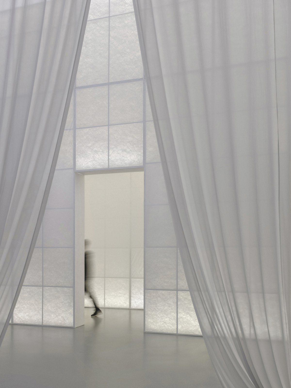 Studio 10 designs exhibition space with white tubular structures and black translucent ramps in China