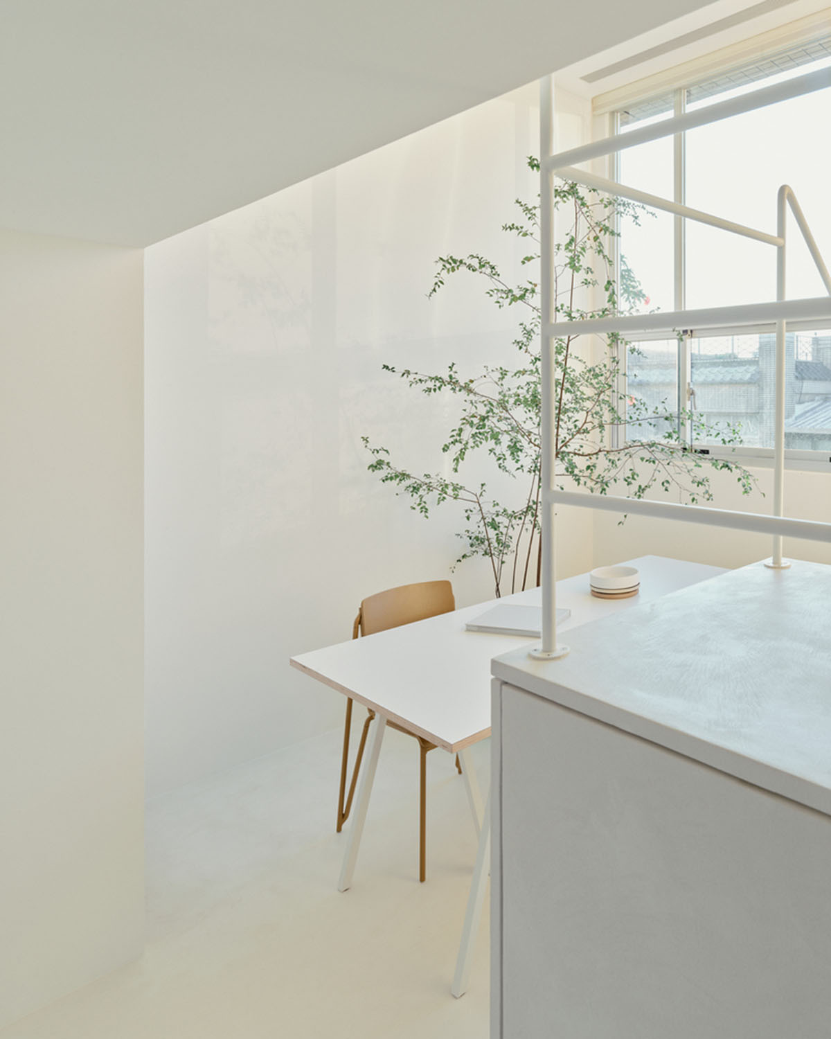 2BOOKS design renovates small apartment in Taipei with light-filled interiors