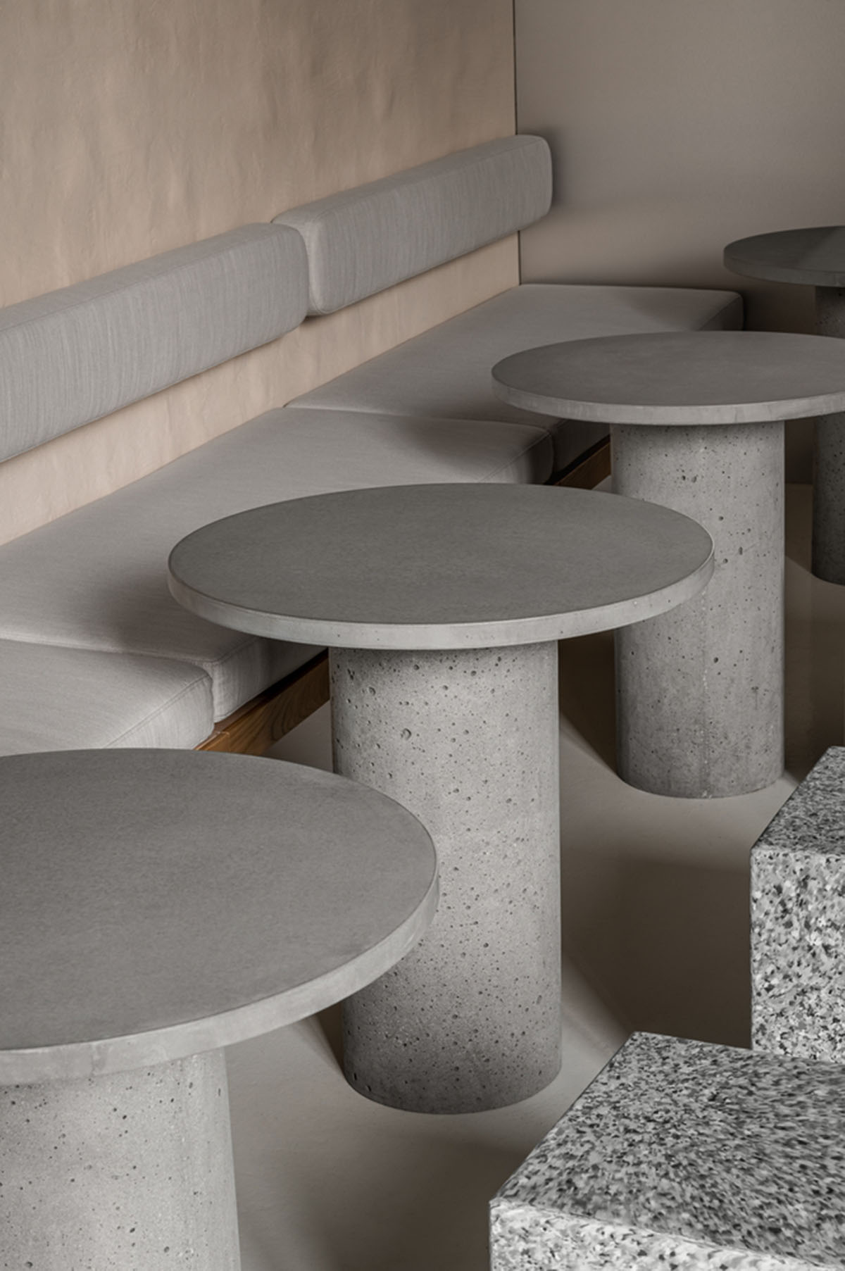 Earth-toned materials and soft lines form interiors of this ready-to-eat food restaurant in Kyiv