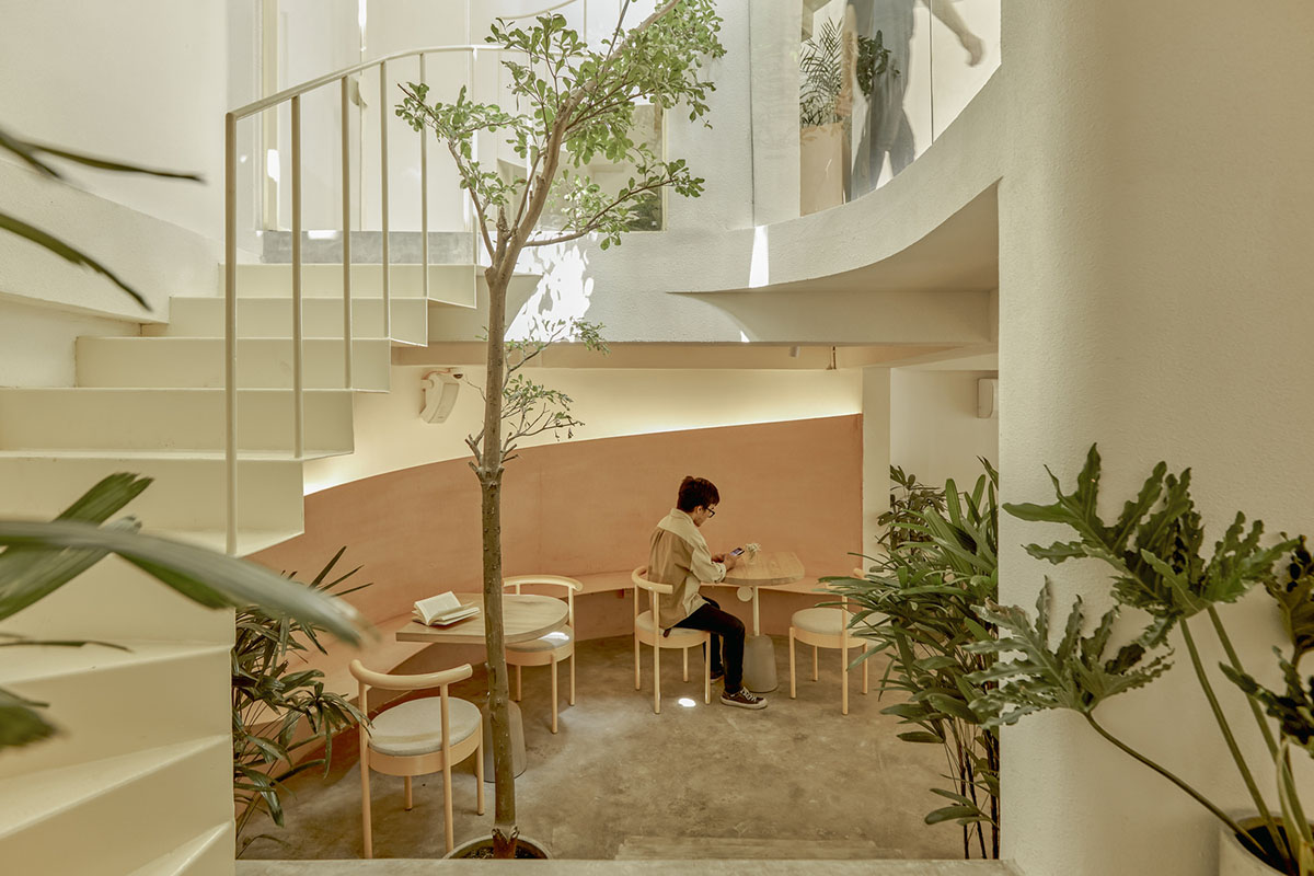September Cafe is designed to look like a bird's nest with curved steel stripes in Vietnam